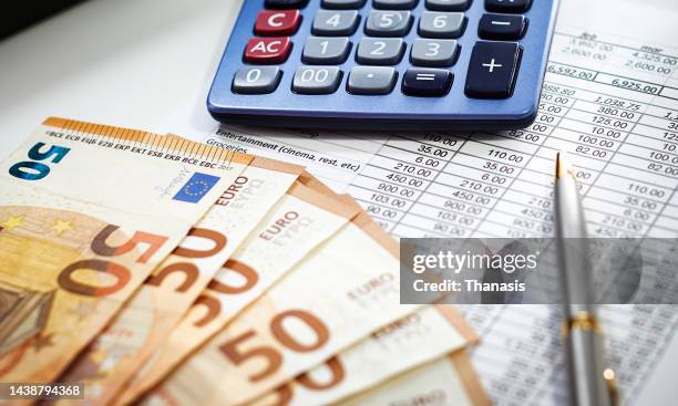 european union currency with calculator and financial theme - libro mastro foto e immagini stock
