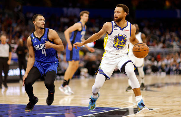 Stephen Curry of the Golden State Warriors drives on Jalen Suggs of the Orlando Magic during a game at Amway Center on November 03, 2022 in Orlando,...