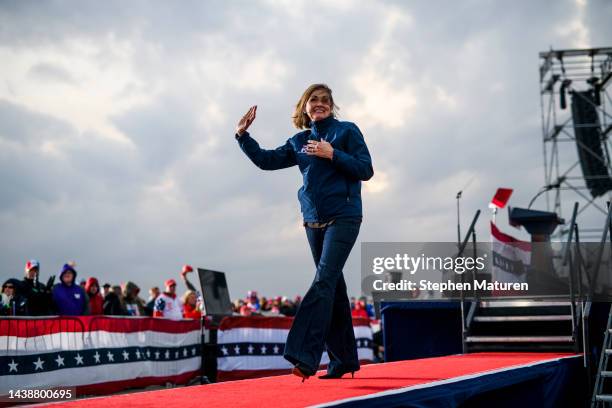 Governor Kim Reynolds waves to the crowd during a campaign event at Sioux Gateway Airport on November 3, 2022 in Sioux City, Iowa. Former U.S....