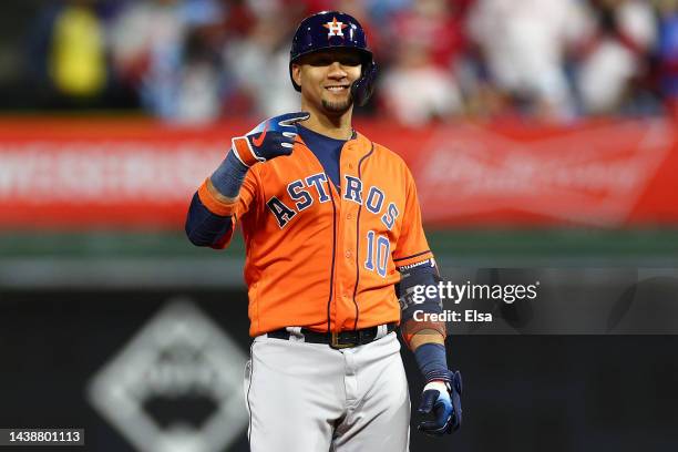 Yuli Gurriel of the Houston Astros reacts after hitting a double against the Philadelphia Phillies during the seventh inning in Game Five of the 2022...