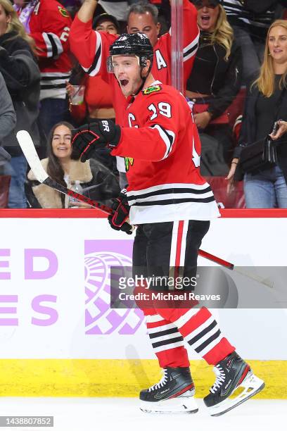 Jonathan Toews of the Chicago Blackhawks celebrates a game-winning goal against the Los Angeles Kings during overtime at United Center on November...