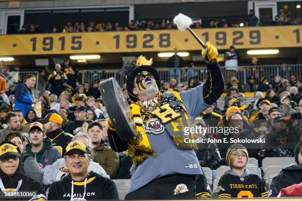Hamilton Tiger-Cats fan bangs a drum during a game against the Ottawa Redblacks at Tim Hortons Field on October 21, 2022 in Hamilton, Canada.