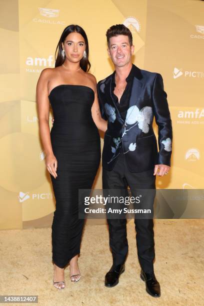 April Love Geary and Robin Thicke attend amfAR Gala Los Angeles 2022 at Pacific Design Center on November 03, 2022 in West Hollywood, California.