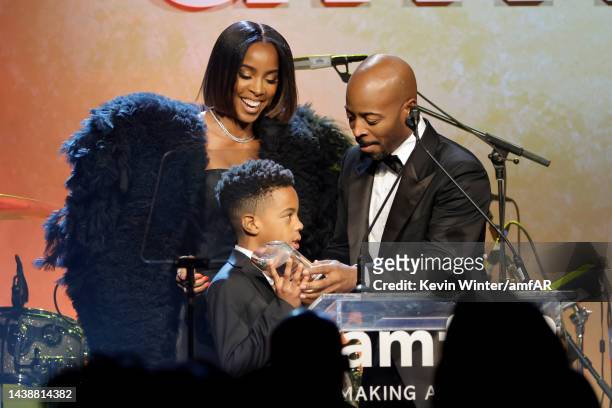 Honoree Kelly Rowland, Titan Jewell Weatherspoon, and Tim Weatherspoon speak onstage during amfAR Gala Los Angeles 2022 at Pacific Design Center on...