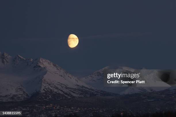 The moon rises over a mountain range at an airport where Republican U.S. Senate candidate Kelly Tshibaka meets with voters on November 03, 2022 in...