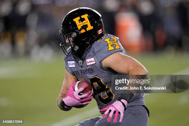 Felix Garand-Gauthier of the Hamilton Tiger-Cats gains yards after a pass reception against the Ottawa Redblacks at Tim Hortons Field on October 21,...