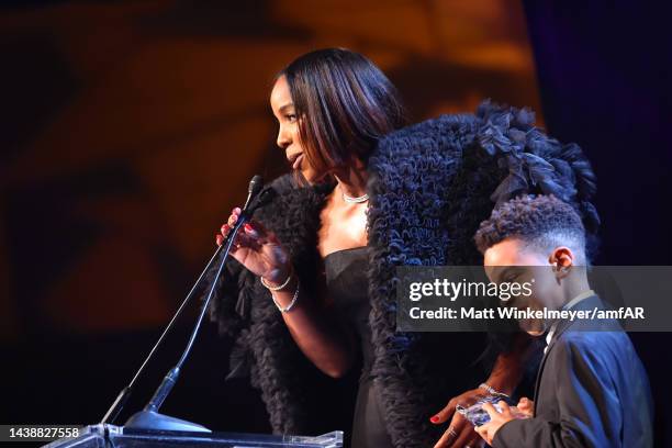 Kelly Rowland and Titan Jewell Weatherspoon speak onstage during amfAR Gala Los Angeles 2022 at Pacific Design Center on November 03, 2022 in West...