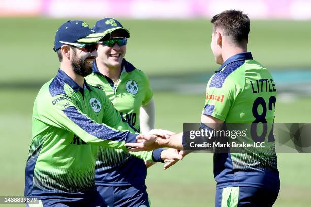 Andrew Balbirnie and Josh Little of Ireland celebrate a wicket during the ICC Men's T20 World Cup match between New Zealand and Ireland at Adelaide...