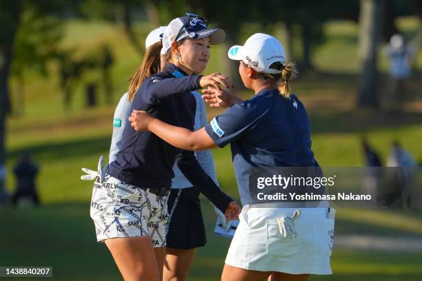 Momoko Ueda and Ai Suzuki of Japan embrace after holing out on the 18th green during the second round of the TOTO Japan Classic at Seta Golf Course...