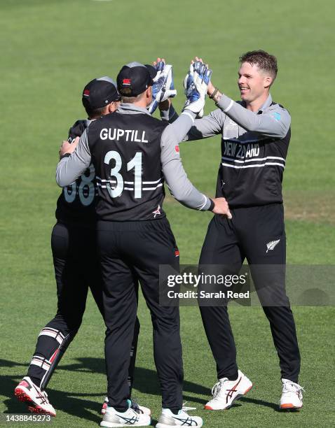 Lockie Ferguson of New Zealand celebrates the wicket of Gareth Delany of Ireland for 10 runs caught Devon Conway of New Zealand during the ICC Men's...