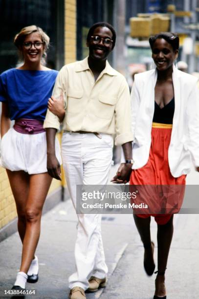 Designer Willi Smith with models Denise Flamino and Toukie Smith in looks from his spring 1979 collection