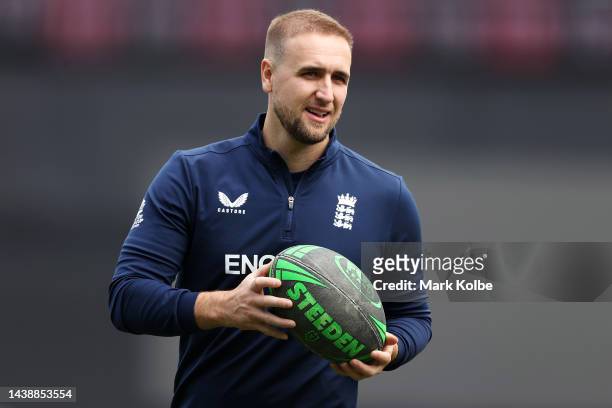 Liam Livingstone of England plays with a rugby league ball during the England T20 World Cup team training session at Sydney Cricket Ground on...