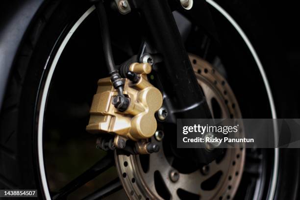 close-up of disc brake of motorcycle - motorcycle tyre stock pictures, royalty-free photos & images