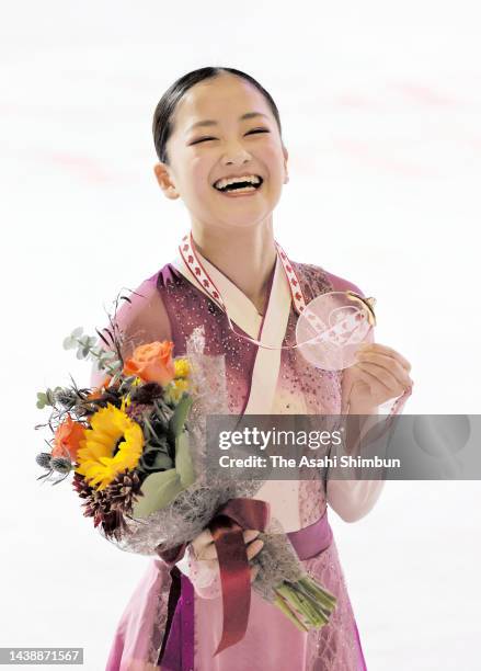 Gold medalist Rinka Watanabe of Japan poses during the medal ceremony for the Women's event during the ISU Grand Prix of Figure Skating - Skate...