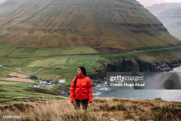 young woman in the village of vidareidi in vidoy, faroe islands. - faroe islands stockfoto's en -beelden