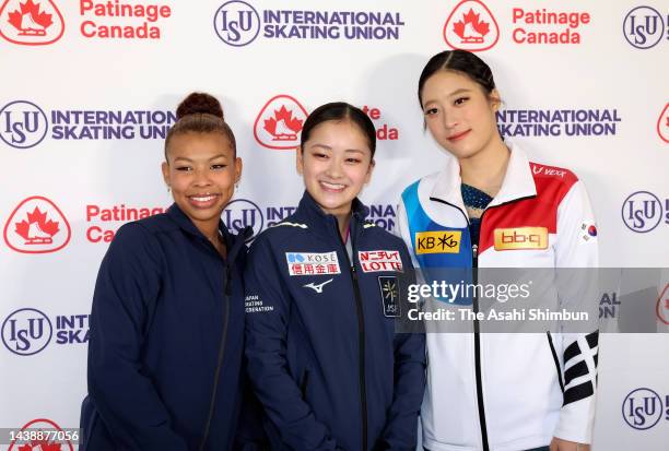 Gold medalist Rinka Watanabe of Japan, silver medalist Starr Andrews of the United States and bronze medalist Young You of South Korea pose after the...