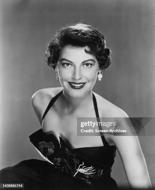 American actress Ava Gardner, wearing a halterneck dress 1952.