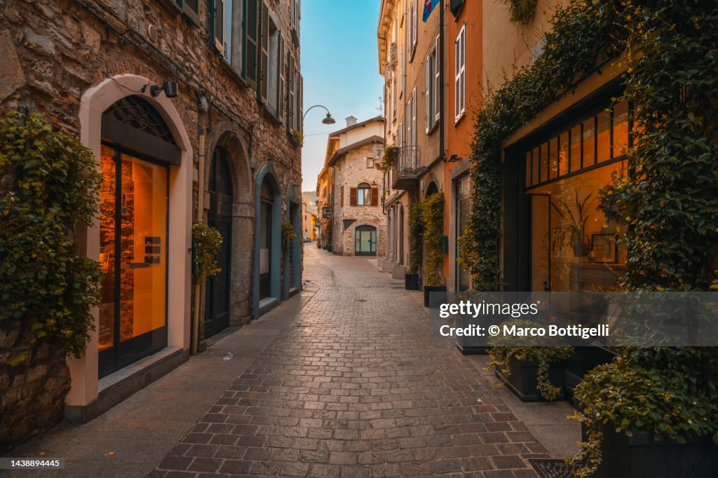 Narrow alley in the old town of Como, Italy.