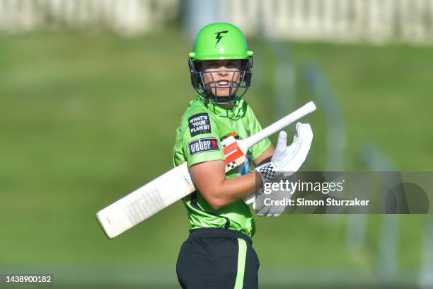 Phoebe Litchfield of the Thunder looks on during the Women's Big Bash League match between the Sydney Thunder and the Brisbane Heat at Blundstone...