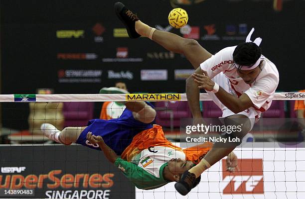 India's KH Niken Singh returns a shot to Singapore during their men's quarter final match on day three of the ISTAF Super Series at ITE Campus on May...