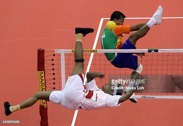 Singapore's Mhd Magrib Bin Ibrahim returns a shot to India during their men's quarter final match on day three of the ISTAF Super Series at ITE...