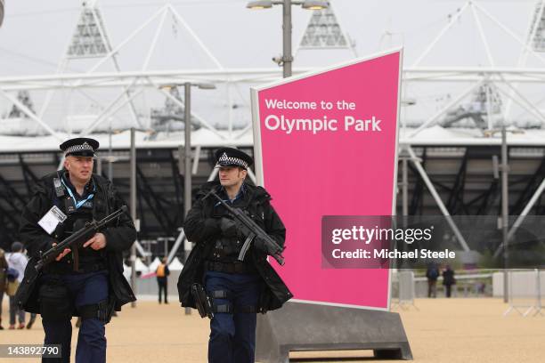 Armed police officers patrol the Olympic Park during day two of the BUCS VISA Athletics Championships 2012 LOCOG Test Event for London 2012 at the...