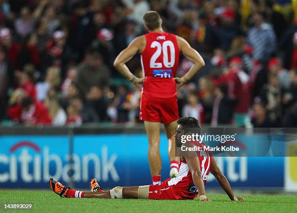 Lewis Jetta of the Swans looks dejected as he sits on the field after defeat during the round six AFL match between the Sydney Swans and the Adelaide...