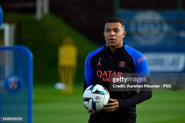 Kylian Mbappe looks on during a Paris Saint-Germain training session at PSG Training Center on November 04, 2022 in Paris, France.