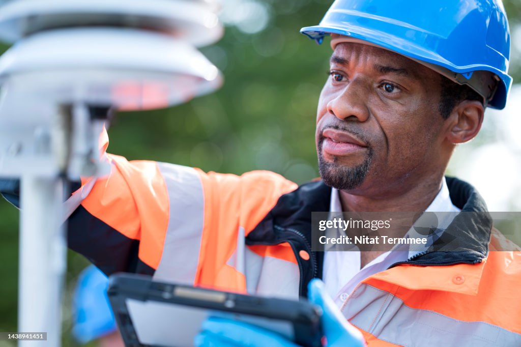 Meteorologists Male Ambient Calibration For Air Quality Monitoring Device In Field ...