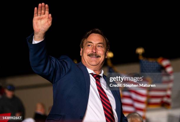 MyPillow CEO Mike Lindell waves as he is introduced while former U.S. President Donald Trump speaks during a campaign event at Sioux Gateway Airport...