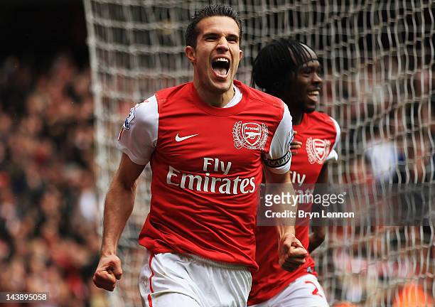 Robin van Persie of Arsenal celebrates scoring their third goal during the Barclays Premier League match between Arsenal and Norwich City at the...