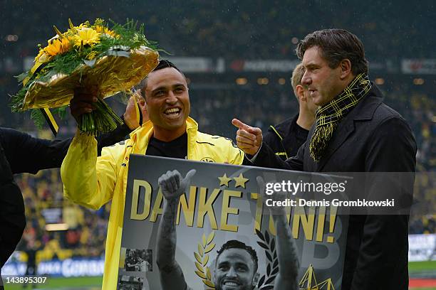 Antonio da Silva of Dortmund and manager Michael Zorc react during a goodbye ceremony prior to the Bundesliga match between Borussia Dortmund and SC...