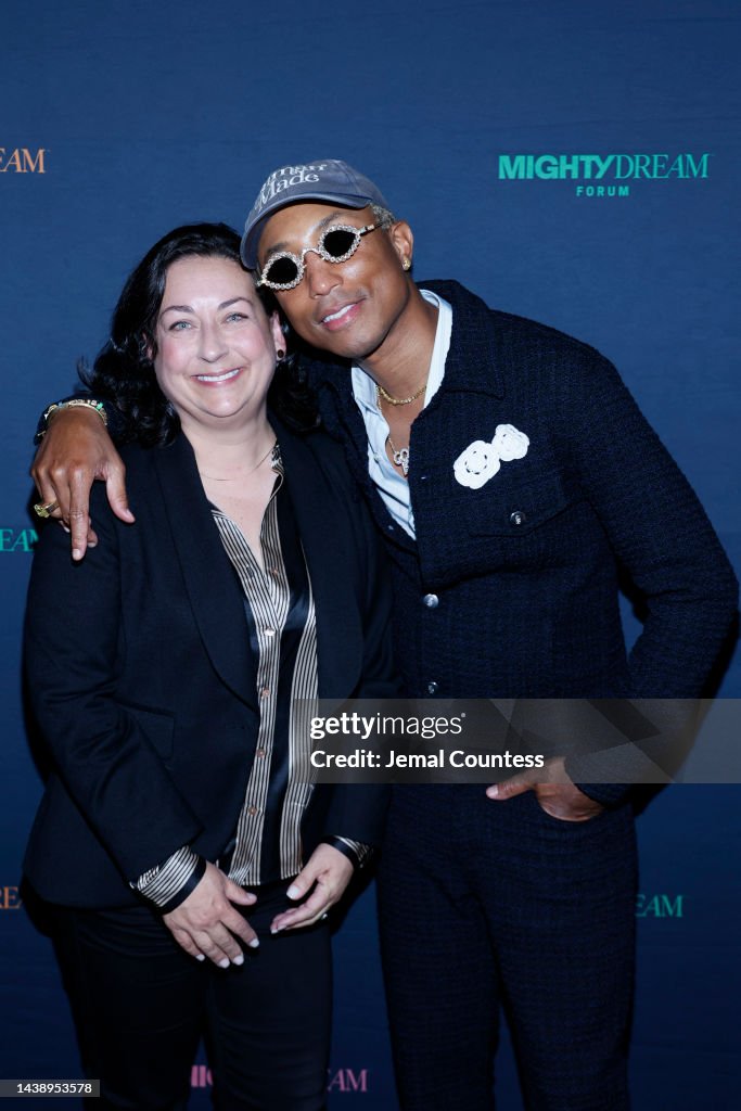 Kate Wilson and Pharrell Williams attend the Mighty Dream Forum... News