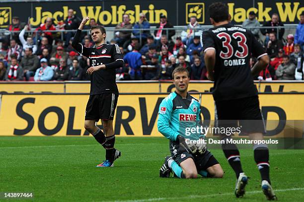 Thomas Muller of Bayern Muenchen celebrates scoring the first goal of the game during the Bundesliga match between 1. FC Koeln and FC Bayern Muenchen...