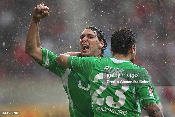 Patrick Helmes and Marco Russ of Wolfsburg celebrate their second goal during the Bundesliga match between VfB Stuttgart and VfL Wolfsburg at...