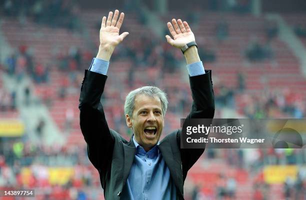 Head coach Lucien Favre of Moenchengladbach celebrates with the fans after winning the Bundesliga match between FSV Mainz 05 and Borussia...