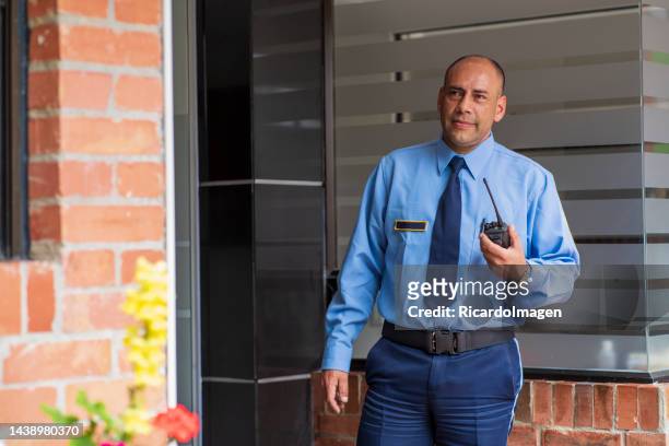 security guards are inside the building that they take care of making sure that everything is in order - guarding stock pictures, royalty-free photos & images