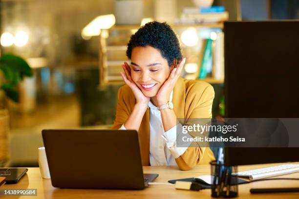 black woman, laptop and smile at wow news at night in office working in social media, advertising or marketing. woman, happy and work with computer at desk excited, surprise and happiness on face - good news icon stock pictures, royalty-free photos & images