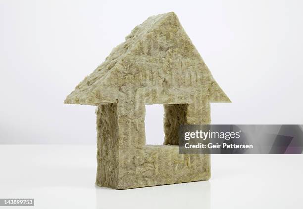 shape of house made from insulation material - insulation stock pictures, royalty-free photos & images