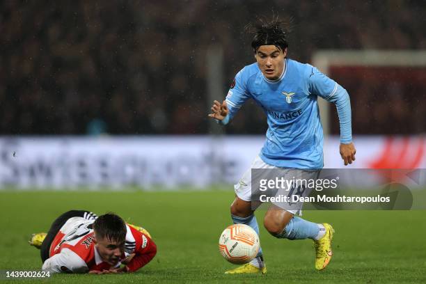 Luka Romero of Lazio battles for the ball with Patrick Walemark of Feyenoord during the UEFA Europa League group F match between Feyenoord and SS...