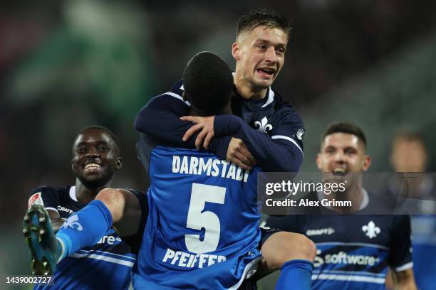 Marvin Mehlem of Darmstadt celebrates their team's first goal with teammate Patric Pfeiffer during the Second Bundesliga match between SV Darmstadt...