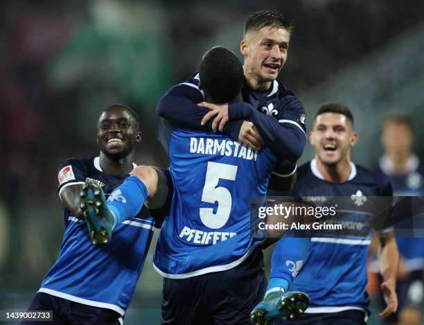 Marvin Mehlem of Darmstadt celebrates their team's first goal with teammate Patric Pfeiffer during the Second Bundesliga match between SV Darmstadt...