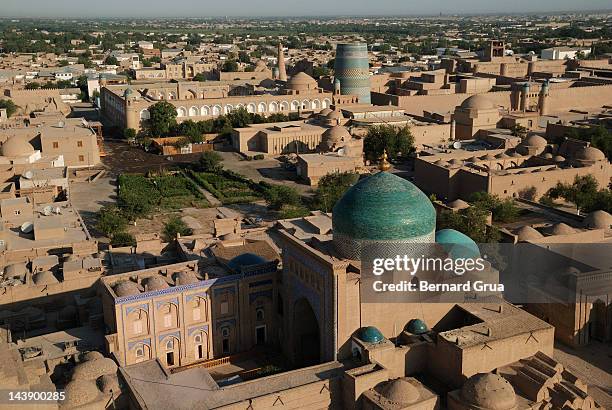 view of khiva from hodja minaret - bernard grua stock pictures, royalty-free photos & images