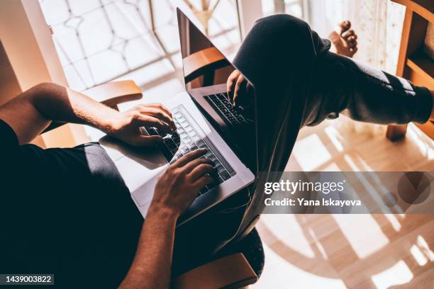 freelancer and programmer working comfortably from home with laptop - generation z covid stock pictures, royalty-free photos & images