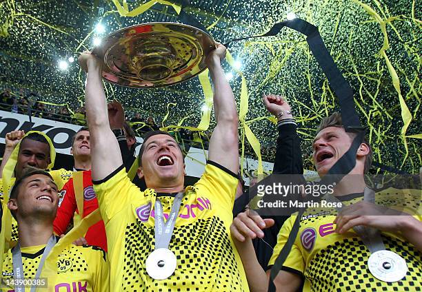 Robert Lewandowski of Dortmund lifts the trophy after winning the german championship after the Bundesliga match between Borussia Dortmund and SC...