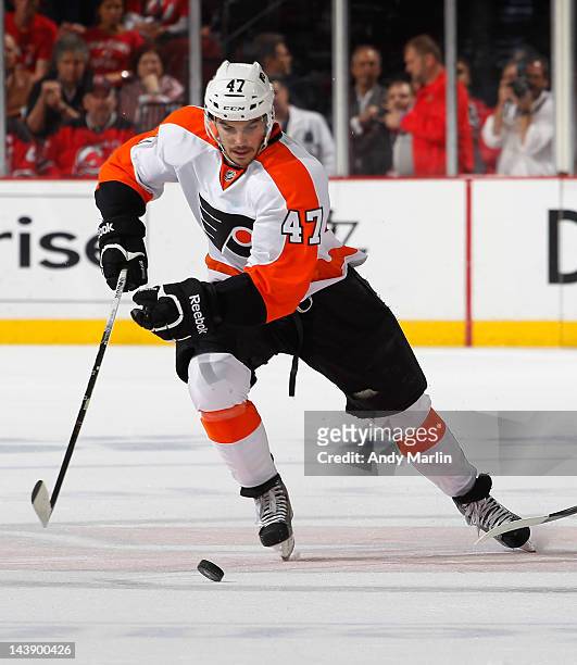 Eric Wellwood of the Philadelphia Flyers plays the puck against the New Jersey Devils in Game Three of the Eastern Conference Semifinals during the...