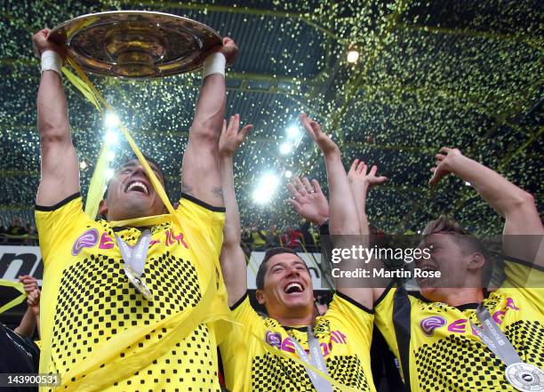 Lucas Barrios of Dortmund lifts the trophy after winning the german championship after the Bundesliga match between Borussia Dortmund and SC Freiburg...