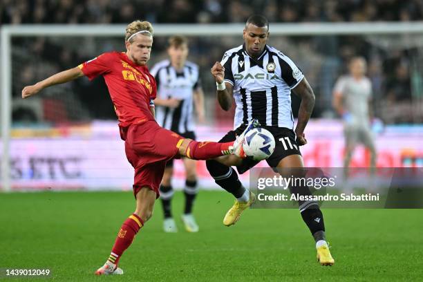 Morten Hjulmand of US Lecce competes for the ball with Walece of Udinese Calcio during the Serie A match between Udinese Calcio and US Lecce at Dacia...