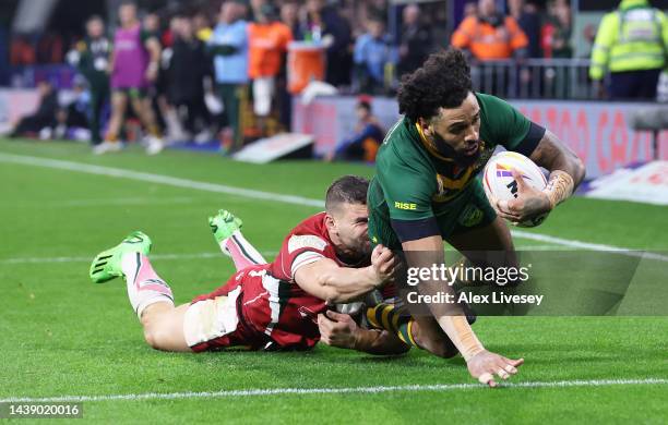 Josh Addo-Carr of Australia touches down for their team's seventh try while tackled by Josh Mansour of Lebanon during the Rugby League World Cup...