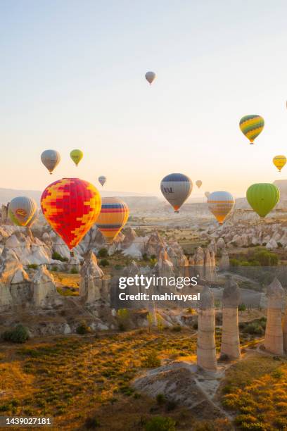 hot air balloons in cappadocia - cappadocia stock pictures, royalty-free photos & images